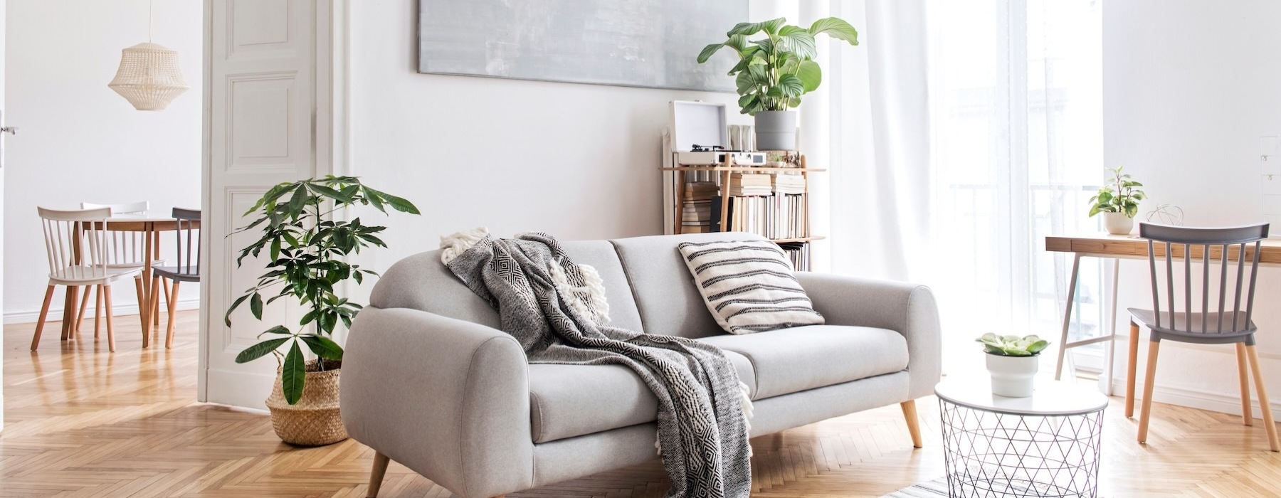 a living room with a couch and chairs