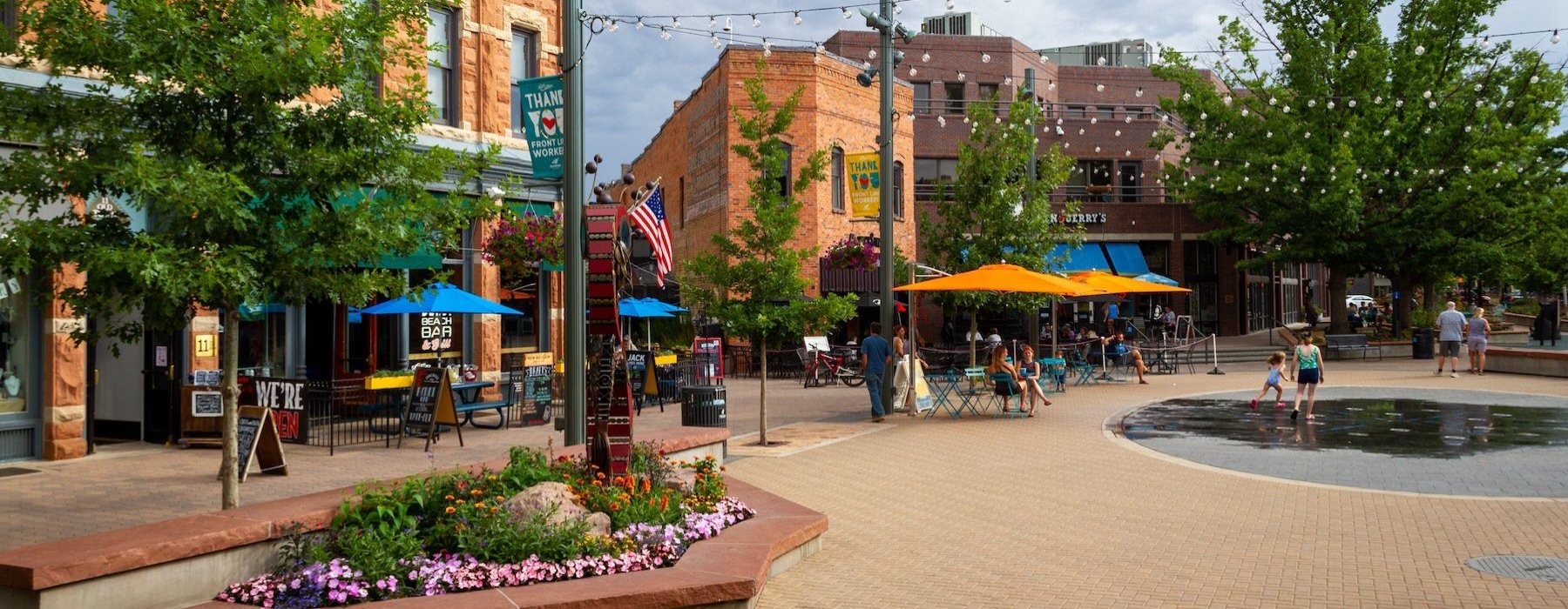 a plaza with trees and people