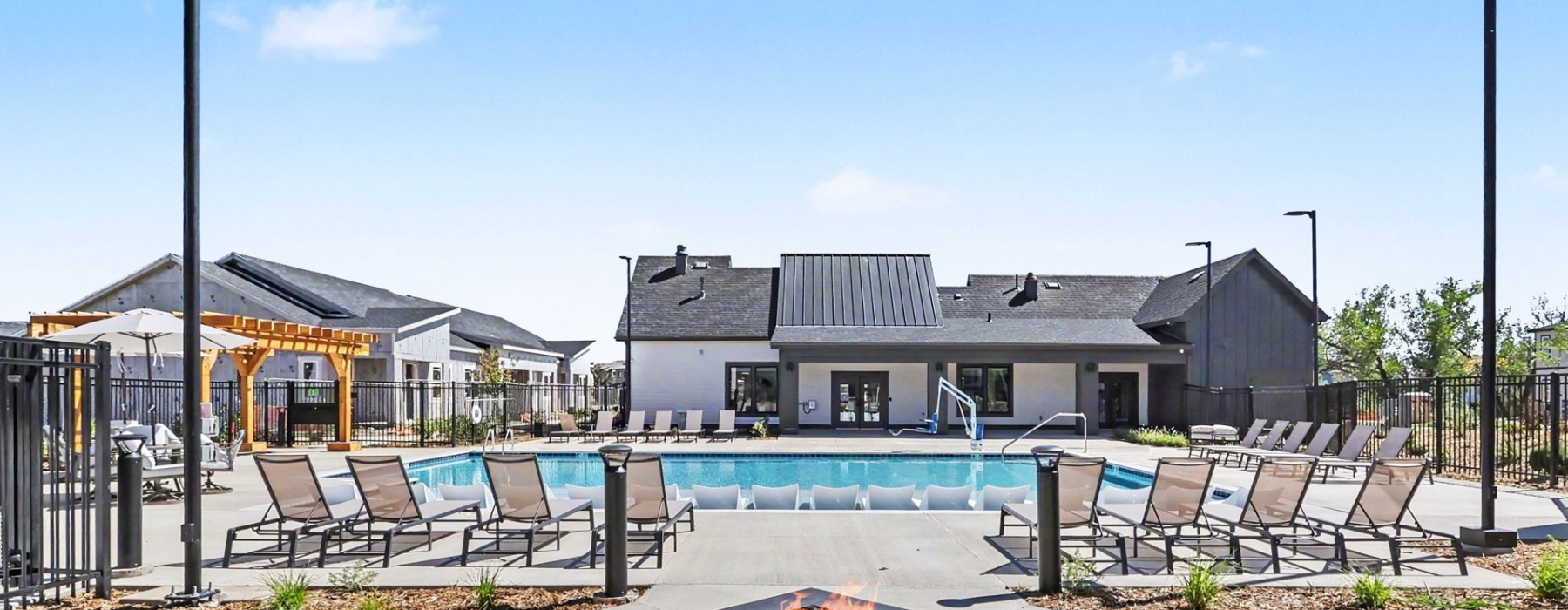 Pool with lounge seating and firepit